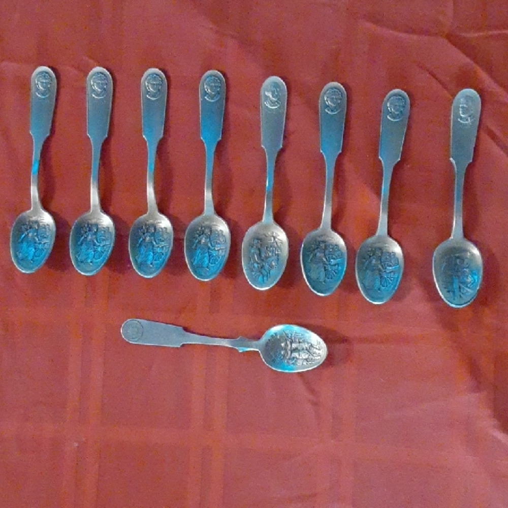 Set of 9 Pewter Spoons with Engraved Design